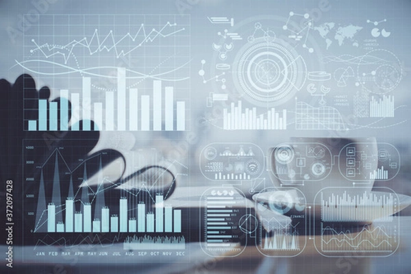 Fototapeta Double exposure of financial chart drawing and desktop with coffee and items on table background. Concept of forex market trading
