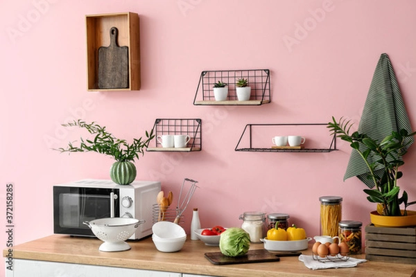 Fototapeta Set of utensils and products on kitchen counter
