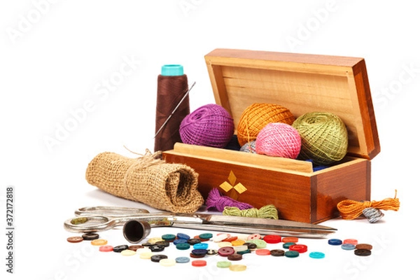 Fototapeta Thread, buttons, scissors on white background. Sewing supplies. 