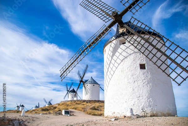 Fototapeta Photo of some beautiful and historic windmills located in Consuegra, Toledo, Spain during a sunny day of summer in a natural place. 