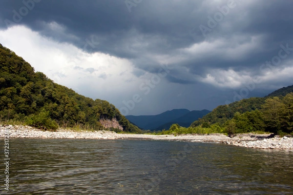 Obraz Beautiful landscape across countryside to mountains in distance with moody sky