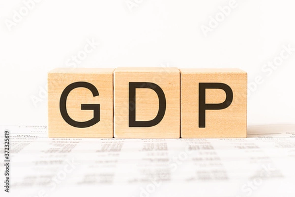 Fototapeta Word GDP. Wooden small cubes with letters isolated on white background with copy space available