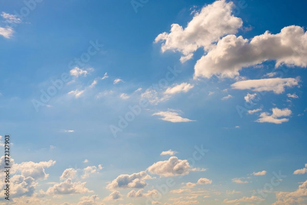 Fototapeta Beautiful blue summer sky with fluffy clouds