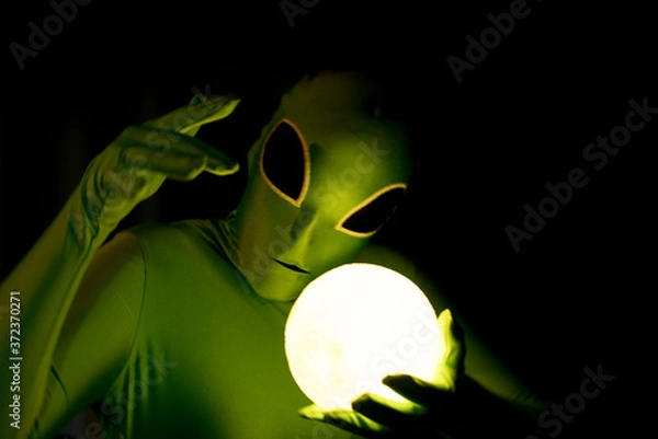 Obraz comical alien with glowing orb