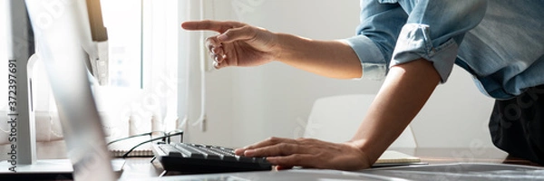 Fototapeta Programmer or software developer Typing New Lines of Code, coding technologies working at wooden industrial interior work place station.