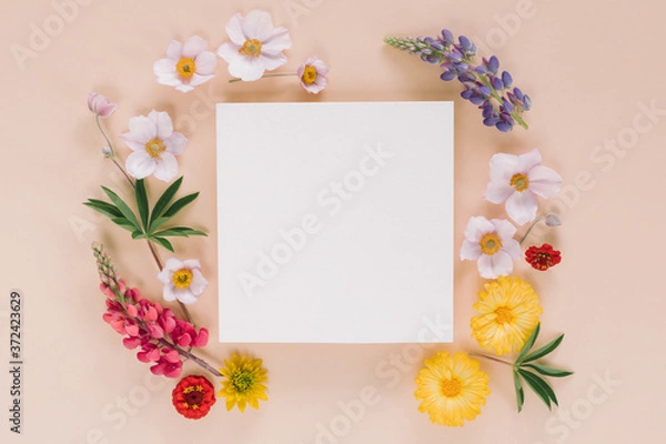 Fototapeta Elegant floral composition with paper blank in the centre. Branding mock up concept.