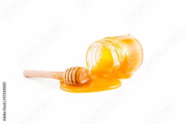 Obraz honey and honey in jar on white background
