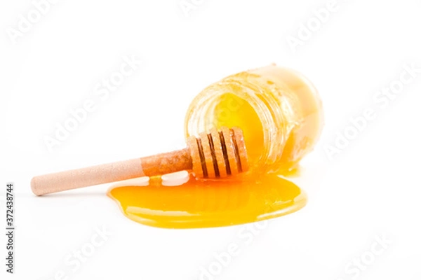 Obraz honey and honey in jar on white background