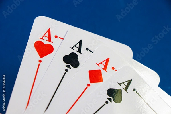 Fototapeta Four aces and chips, card game, cards on the table. Poker and blackjack.