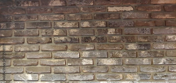 Obraz Brown-colored spotted block wall_background