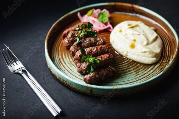 Fototapeta Beef donuts with onions and potatoes
