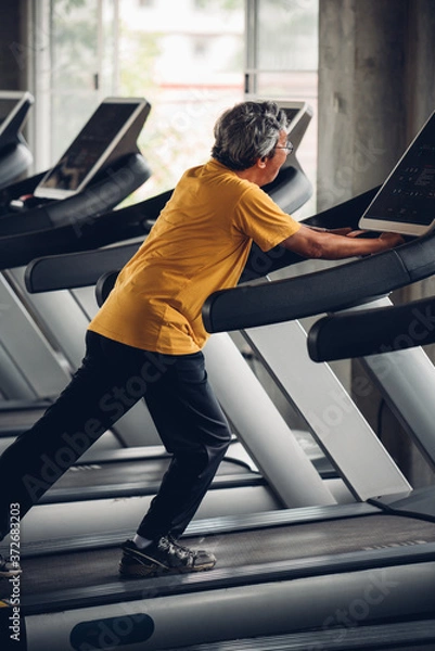 Obraz Senior Man Exercising In Gym