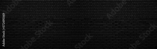 Fototapeta Abstract black brick wall texture for background or wallpaper design. panorama picture.