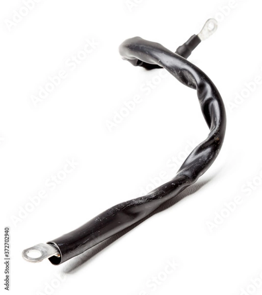 Fototapeta Thick short curved red electric wire in black rubber isolation on a white isolated background. Automotive positive terminal. Auto service industry.