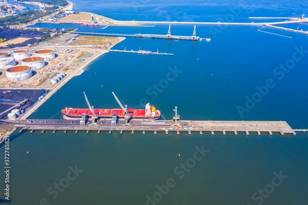 Fototapeta Aerial top view container cargo ship, in import export business logistic and transportation by container ship international open sea.