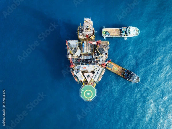 Fototapeta Aerial view offshore jack up rig at the offshore location during sunset