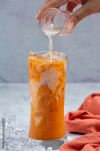 Obraz Iced milk tea on marble pattern floor It is a delicious and nutritious relaxation drink.