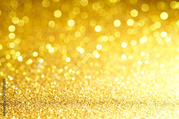Fototapeta gold Sparkling Lights Festive background with texture. Abstract Christmas twinkled bright bokeh defocused and Falling stars. Winter Card or invitation	