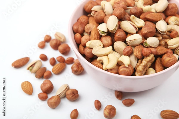 Obraz Set of different nuts on a light background.
