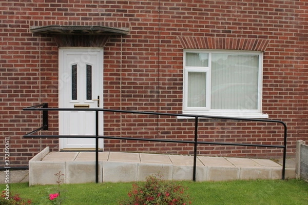 Fototapeta Disabled access  wheelchair ramp on front elevation of a  UK house