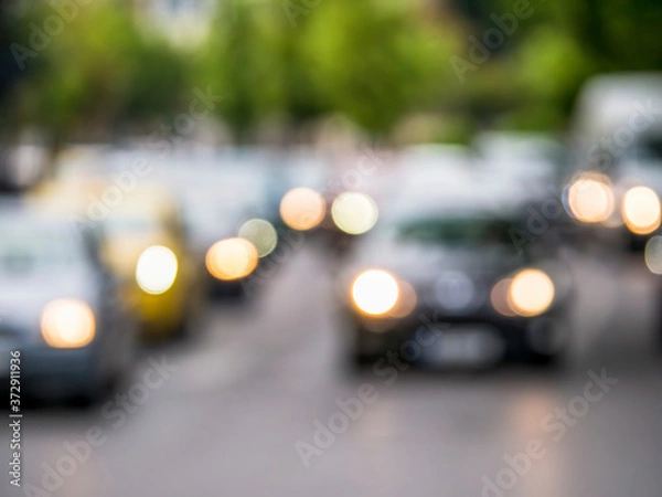 Fototapeta Out of focus car traffic. Bokeh blurred car lights.