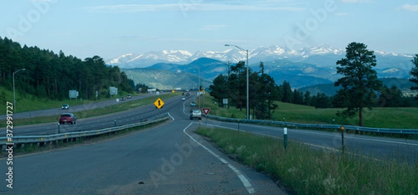 Obraz Merging onto highway with mountains in view in windshield