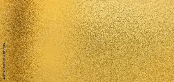 Fototapeta Gold texture background with yellow luxury shiny shine glitter sparkle of bright light reflection on golden surface, for celebration backdrop,
