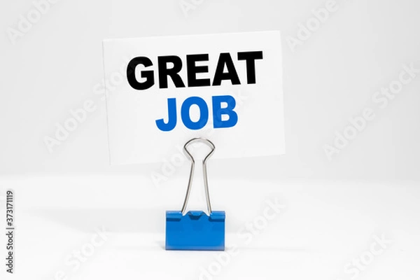 Obraz GREAT JOB inscription on a white business card on a white endless background in a blue clip.