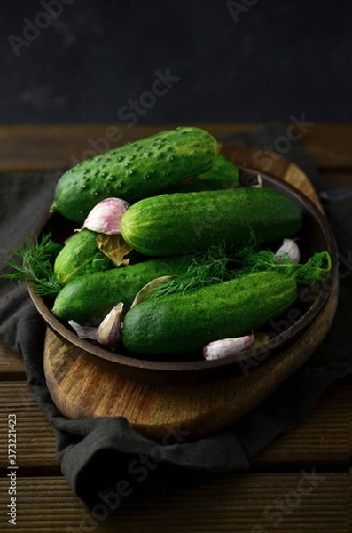 Obraz Fresh cucumbers with herbs on plate