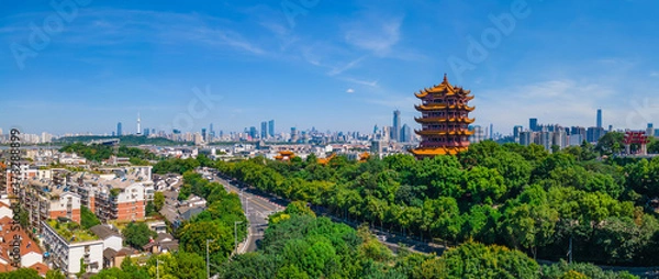 Fototapeta The yellow crane tower.Aerial view of  Wuhan city .Panoramic skyline and buildings beside yangtze river.