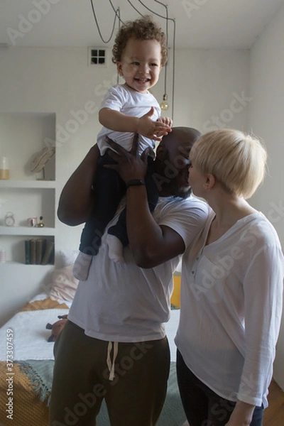 Fototapeta happy family at home, different nationalities