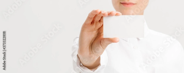 Fototapeta  close-up portrait of a young businesswoman with Blank Business Card