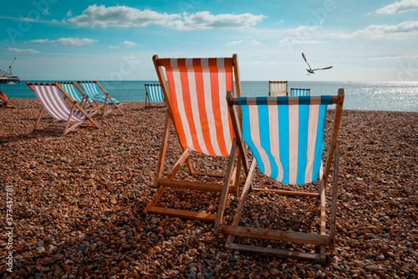 Fototapeta Empty Deckchairs on Beach