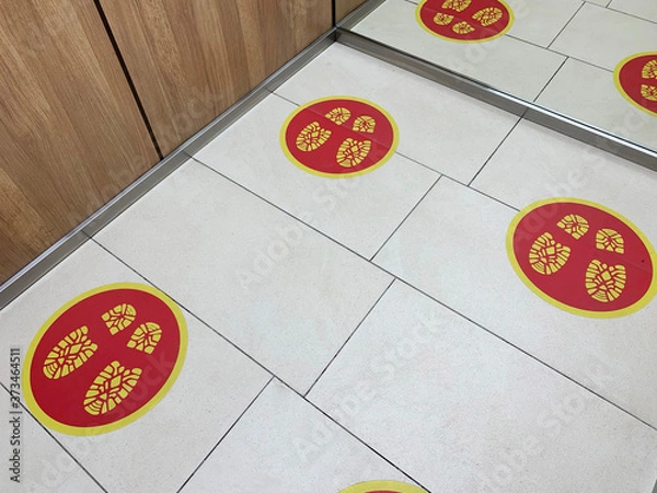 Fototapeta Social distance signs on the floor in the elevator