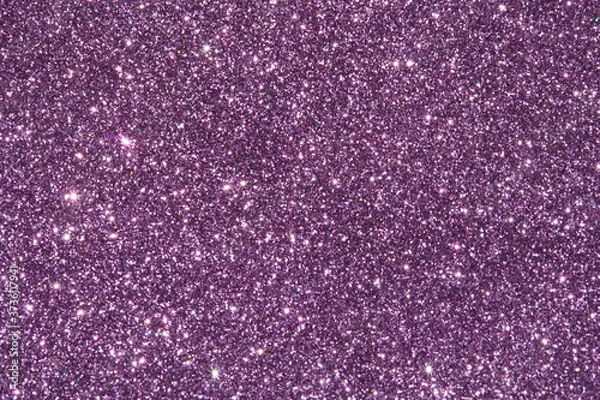 Fototapeta purple Sparkling Lights Festive background with texture. Abstract Christmas twinkled bright bokeh defocused and Falling stars. Winter Card or invitation	