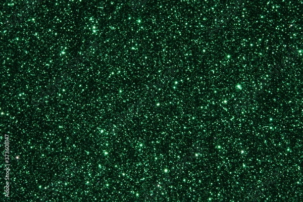 Fototapeta Green Sparkling Lights Festive background with texture. Abstract Christmas twinkled bright bokeh defocused and Falling stars. Winter Card or invitation	