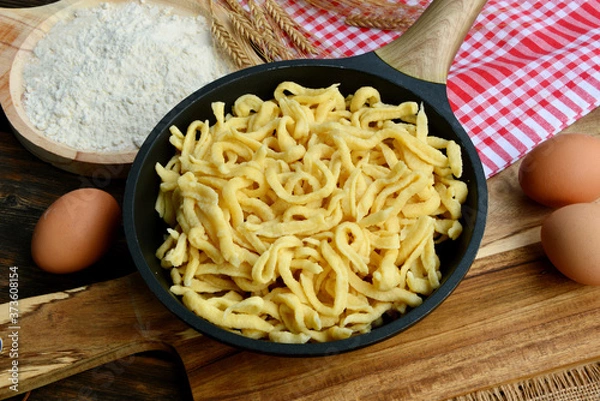Fototapeta Spätzle  are a kind of soft egg noodle  also Spätzli or Chnöpfli in Switzerland or Knöpfle or Hungarian Nokedli, Csipetke or Galuska