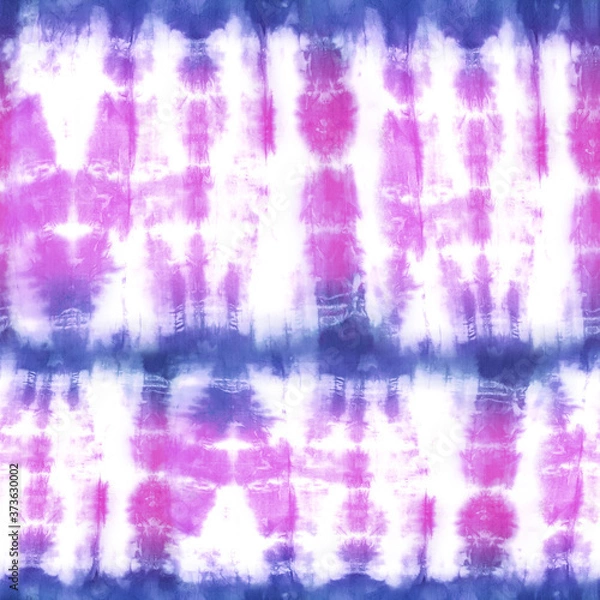 Fototapeta Quality genuine tie dye repeat pattern in muted hues of pink and indigo blue. Seamless repeating pattern.