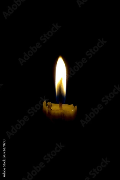 Obraz the candle flame in the dark of the night