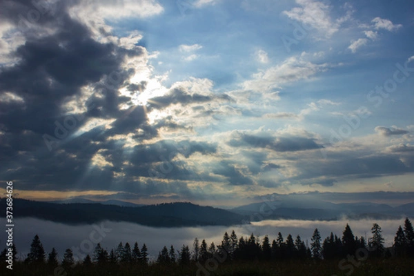 Obraz morning summer mountain landscape with fog and clouds in the sky