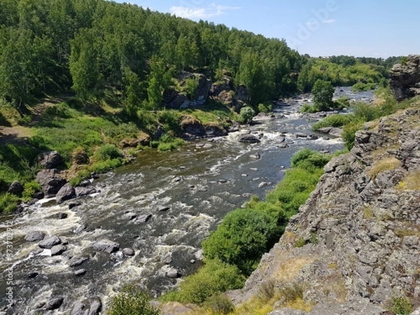 Fototapeta Large boulders in a mountain river