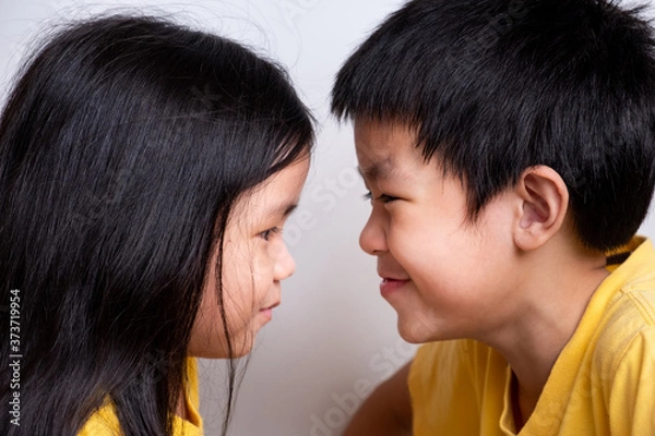 Fototapeta positive emotion of children, happiness, smiling, laughing, enjoy on white background. lovely relationship of brother and sister. portrait of children's feeling