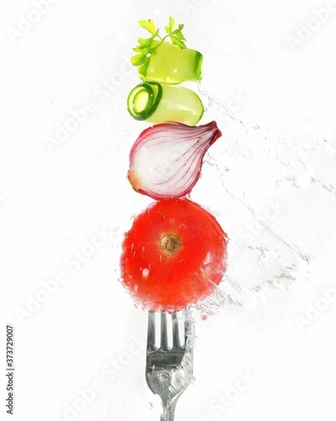 Fototapeta on a white table on white plates are two hamburgers with different fillings, next to cucumbers and tomatoes