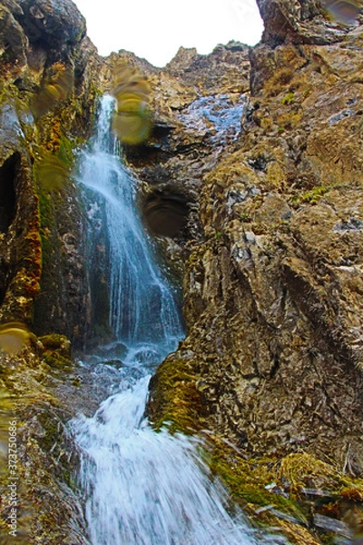 Fototapeta waterfall in the mountains
