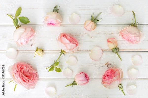 Obraz Pink roses on white vintage boards, top view
