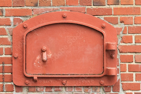 Obraz red brick wall with door