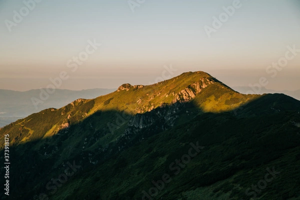 Fototapeta Amazing sunset in the wild ukrainian ridge Marmarosy, near Romania