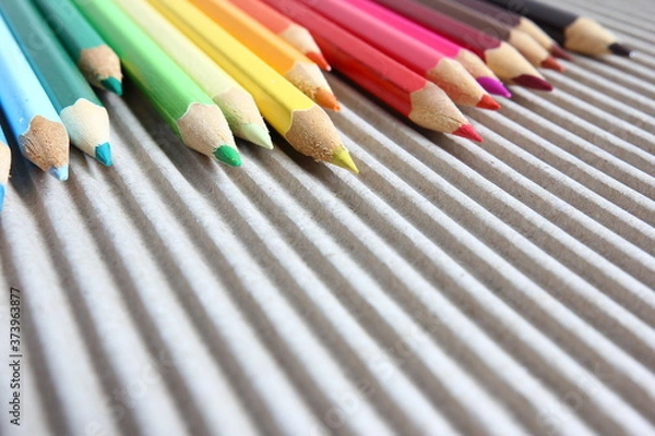 Obraz Close-up on color pencils on brown corrugated cardboard