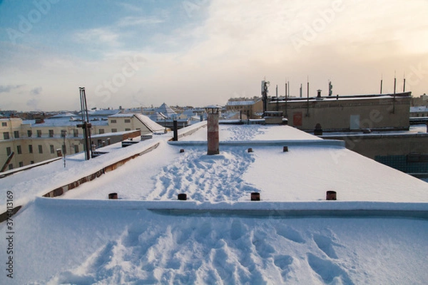 Obraz Footprints on snowy rooftop