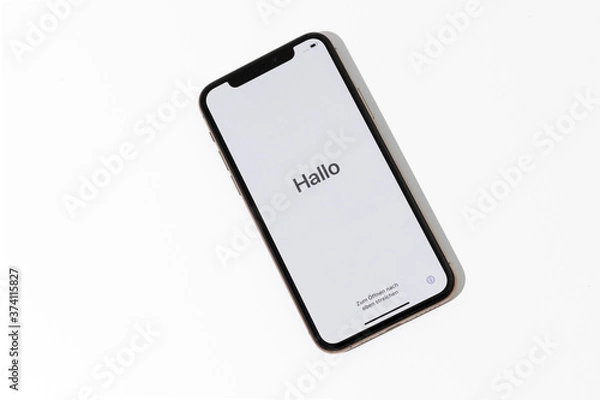 Fototapeta Welcome hello in different languages white screen on starting of the smartphone 